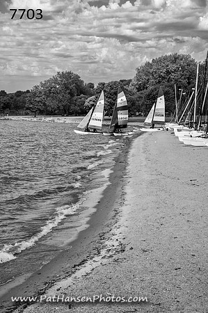 7703 L&C Lake shoreline & three hobie cats