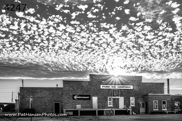 4247 Ice House, sunburst, & puffy clouds