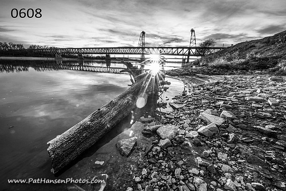 0608 rocky shore, log, and Meridian Bridge